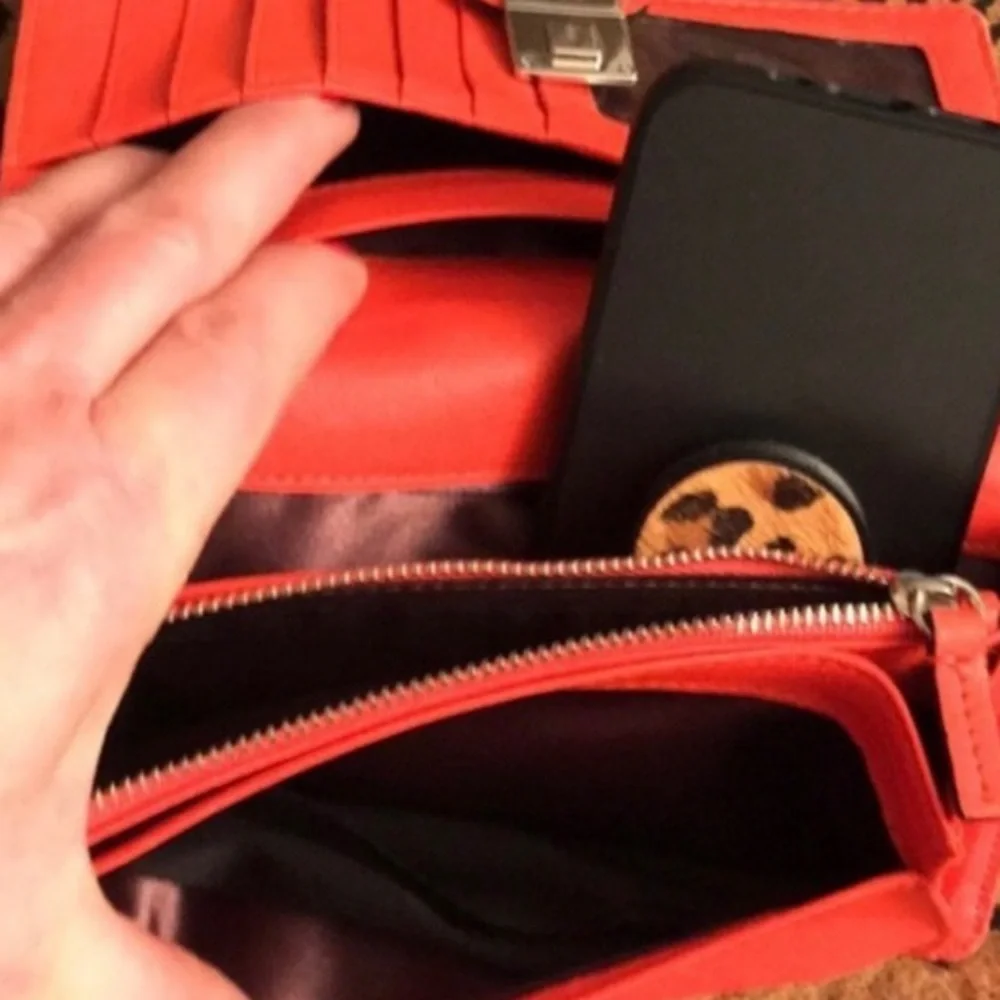 Milly wristlet orange mobile wallet front snap ,zip  lots of pockets
